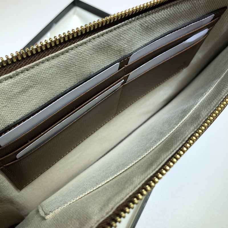 G*u*i clutch bag
