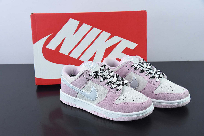 the nike dunk low appears in pink and grey suede dv3054-600